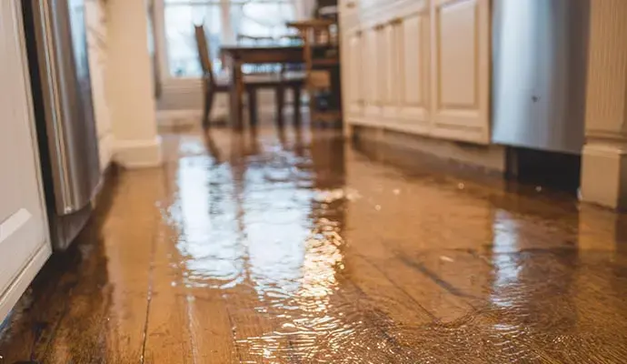 Water spread across a kitchen floor in a Woodside home